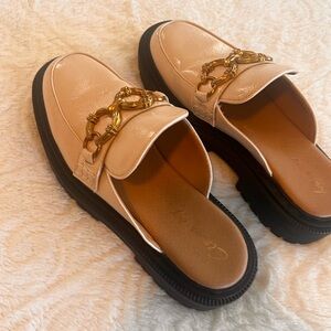 SAM EDELMAN Tan Mules with Gold metal accent.
